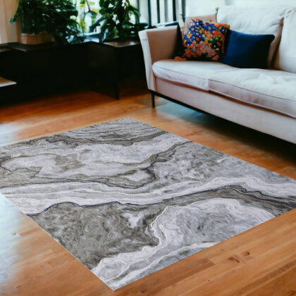 5' x 7' Ivory Blue and Gray Abstract Power Loom Area Rug