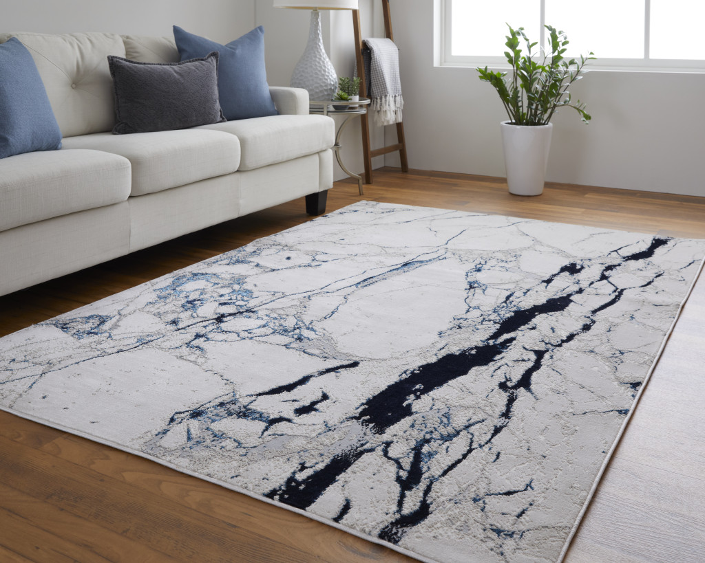 5' x 8' Ivory and Blue Marble Power Loom Distressed Area Rug