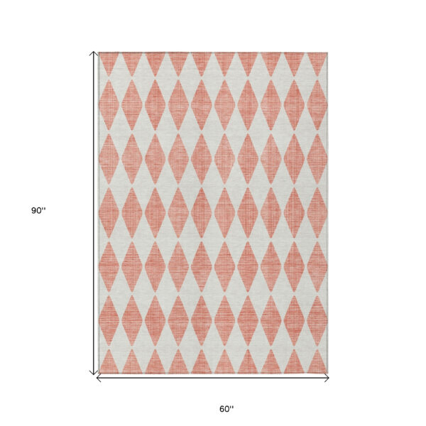 5' X 8' Salmon And Ivory Geometric Washable Indoor Outdoor Area Rug