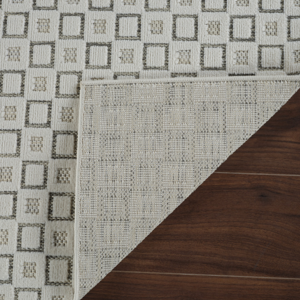 5' X 7' Cream and Beige Geometric Distressed Indoor Outdoor Area Rug
