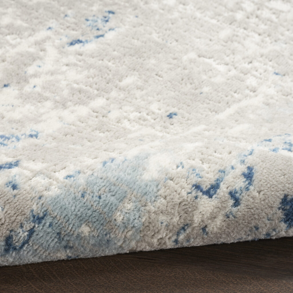 5' x 7' Ivory Abstract Power Loom Area Rug