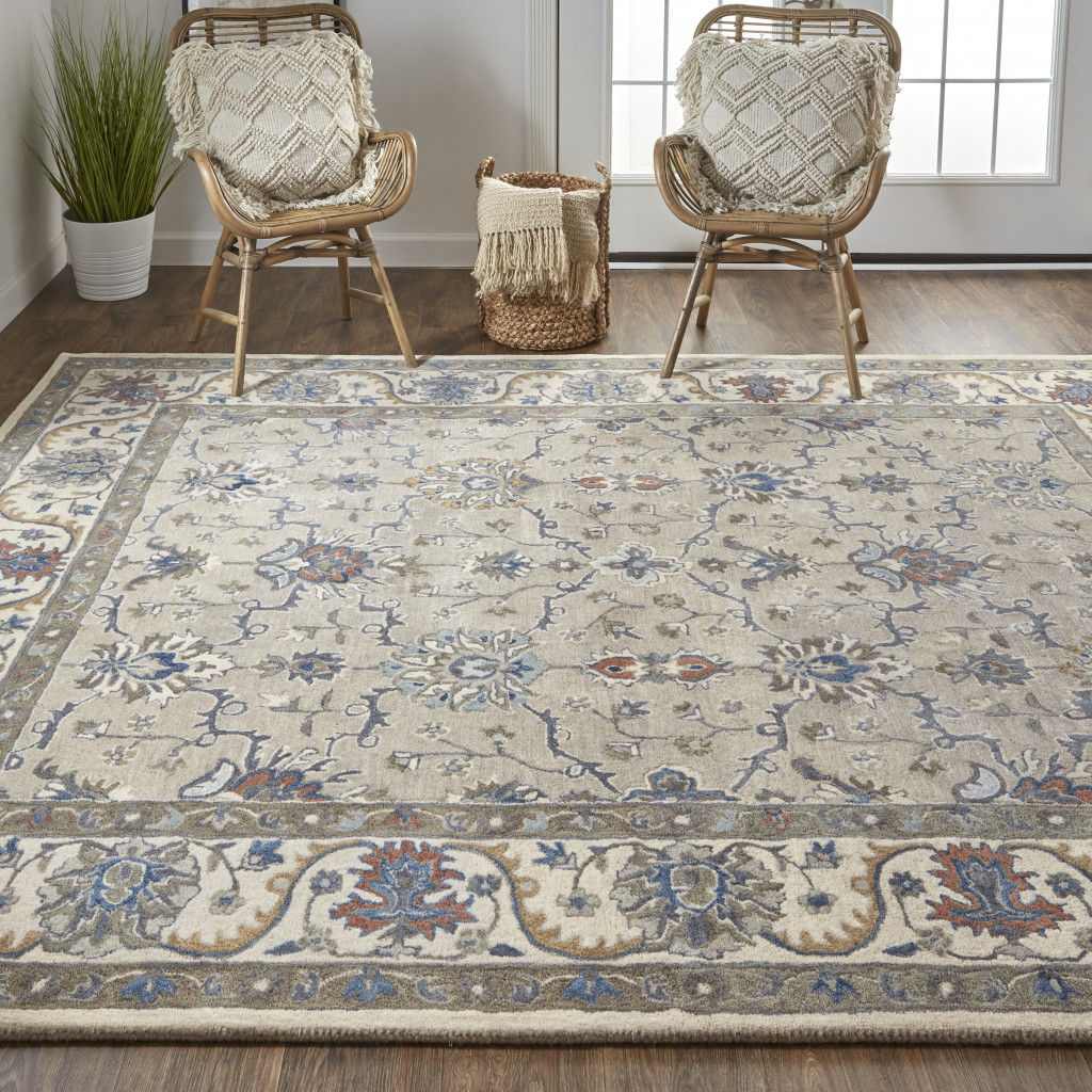 5' X 8' Taupe Ivory And Blue Wool Floral Tufted Handmade Stain Resistant Area Rug