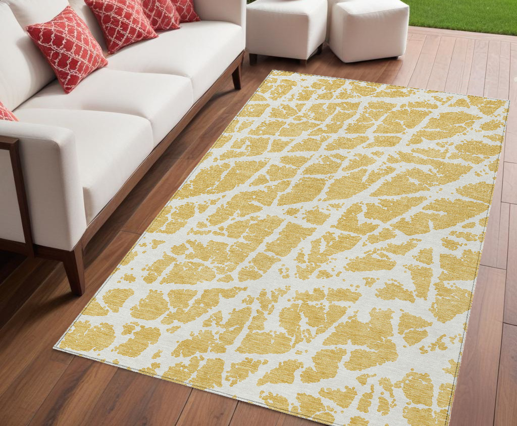 5' X 8' Gold and White Abstract Washable Non Skid Indoor Outdoor Area Rug