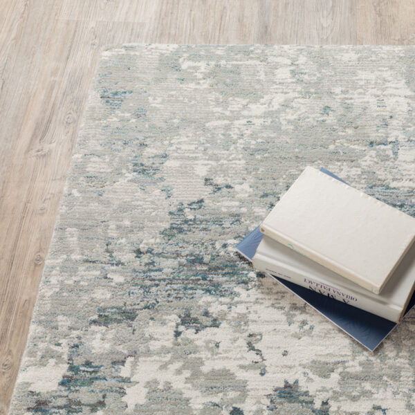 8' X 10' Blue Beige And Teal Abstract Power Loom Stain Resistant Area Rug