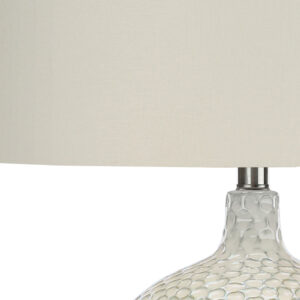 28" White and Silver Ceramic Round Table Lamp With Cream Drum Shade