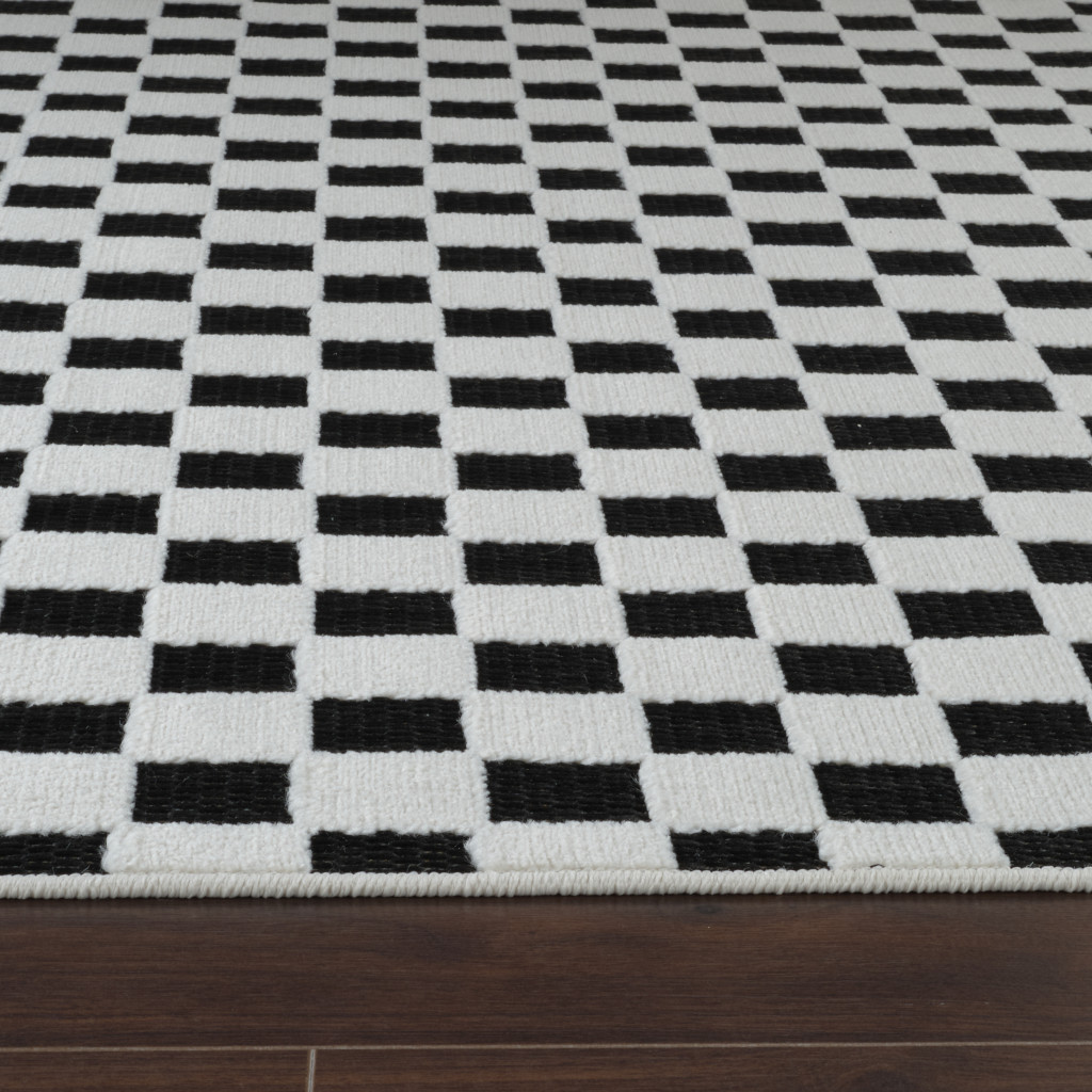 5' X 7' Black and White Geometric Distressed Indoor Outdoor Area Rug