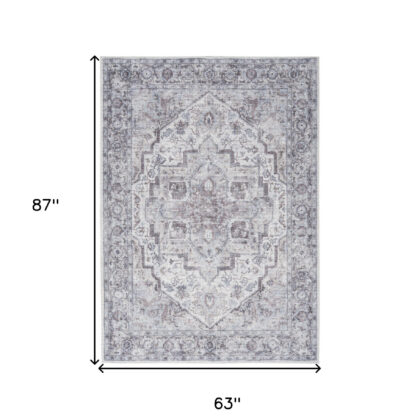5' X 7' Blue And Pink Floral Power Loom Distressed Washable Area Rug