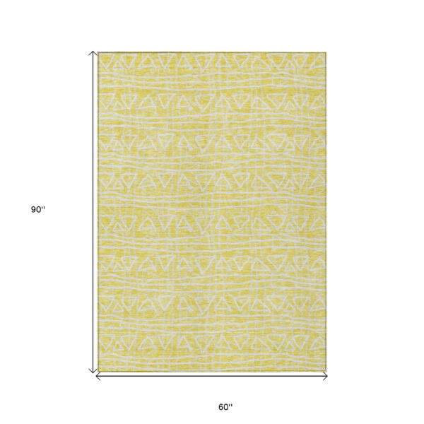 5' X 8' Yellow And Ivory Geometric Washable Indoor Outdoor Area Rug