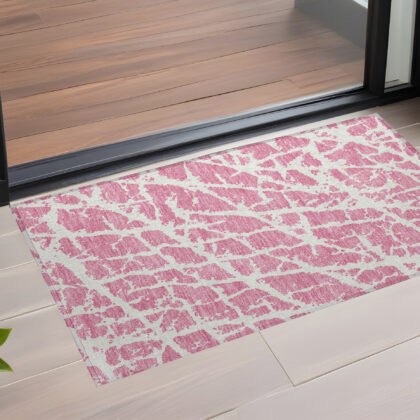 3' X 5' Pink and Ivory Abstract Washable Non Skid Indoor Outdoor Area Rug