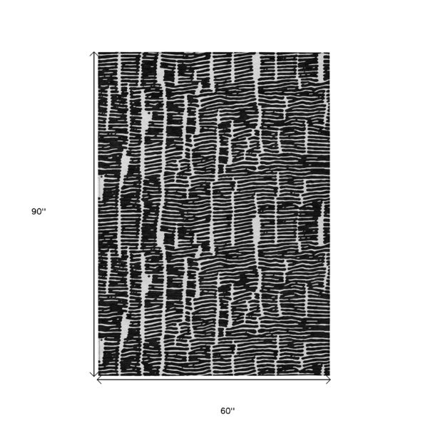 5' X 8' Black And Ivory Abstract Washable Indoor Outdoor Area Rug