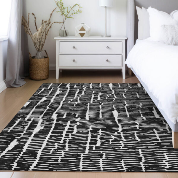 5' X 8' Black And Ivory Abstract Washable Indoor Outdoor Area Rug
