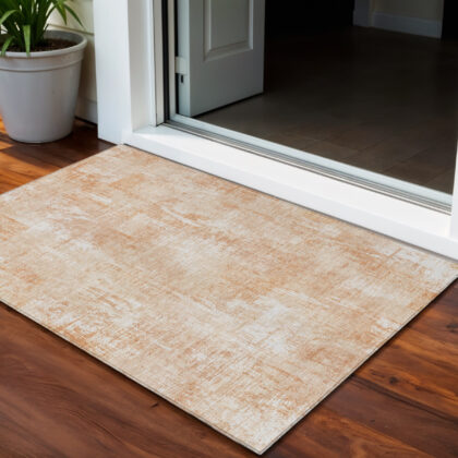 3' X 5' Coral Peach And Ivory Abstract Washable Indoor Outdoor Area Rug