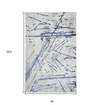 5' x 8' Ivory and Blue Abstract Area Rug