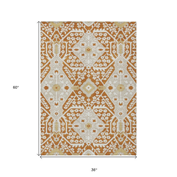 3' X 5' Orange Beige And Gold Floral Washable Indoor Outdoor Area Rug