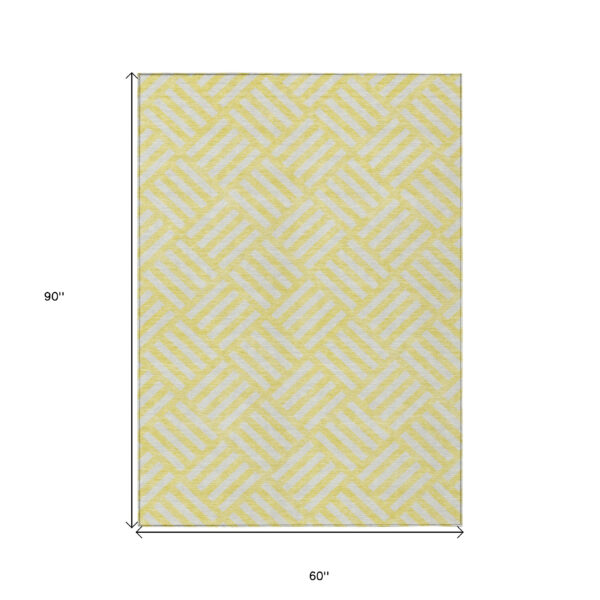5' X 8' Yellow And Ivory Geometric Washable Indoor Outdoor Area Rug