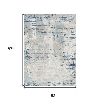 5' x 7' Ivory Abstract Power Loom Area Rug