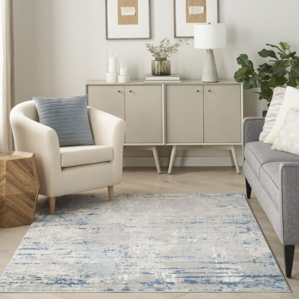 5' x 7' Ivory Abstract Power Loom Area Rug