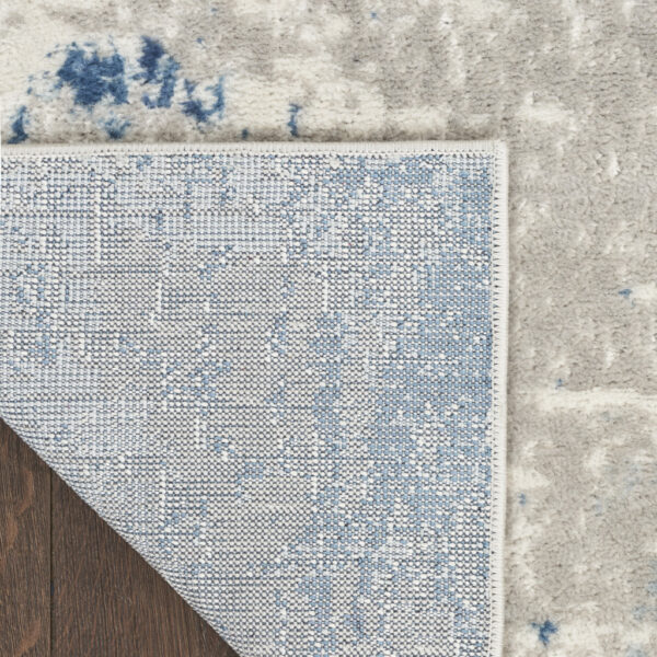 5' x 7' Ivory Abstract Power Loom Area Rug