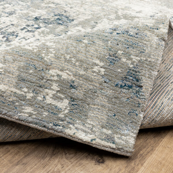 6' X 9' Blue Beige And Teal Abstract Power Loom Stain Resistant Area Rug