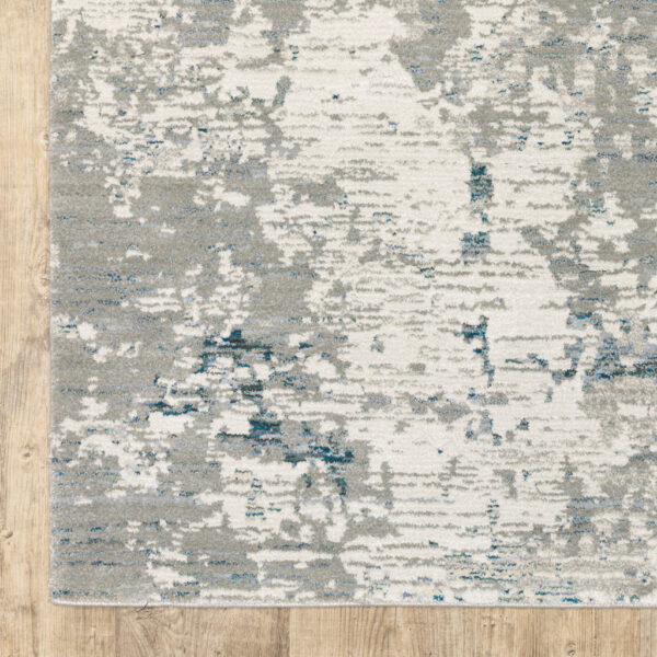 6' X 9' Blue Beige And Teal Abstract Power Loom Stain Resistant Area Rug