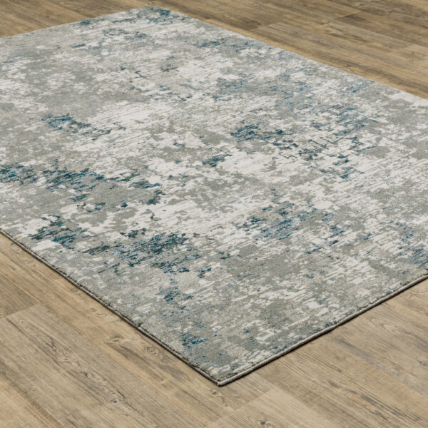 6' X 9' Blue Beige And Teal Abstract Power Loom Stain Resistant Area Rug