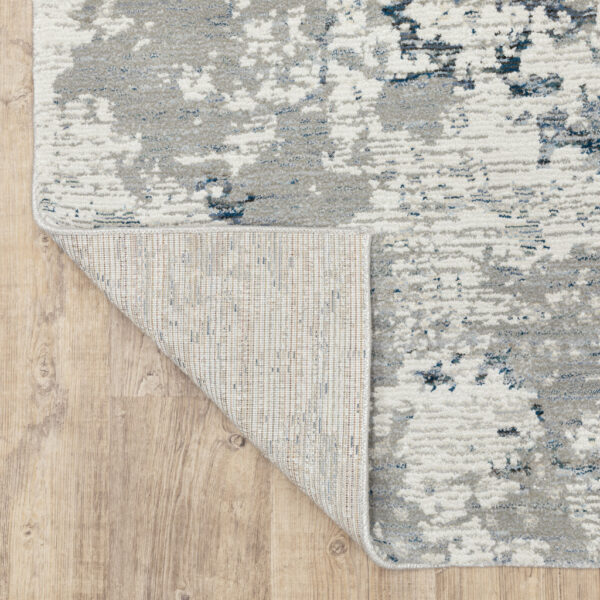 6' X 9' Blue Beige And Teal Abstract Power Loom Stain Resistant Area Rug