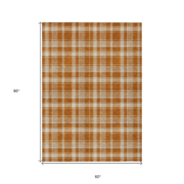 5' X 8' Orange and Ivory Plaid Washable Non Skid Indoor Outdoor Area Rug