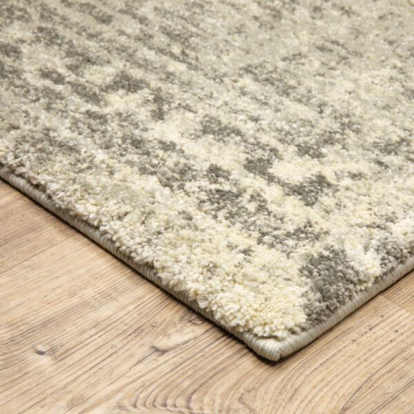 6' X 9' Grey Ivory Beige And Taupe Oriental Power Loom Stain Resistant Area Rug
