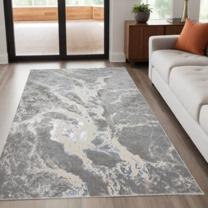 5' x 8' Gray and Ivory Abstract Power Loom Area Rug