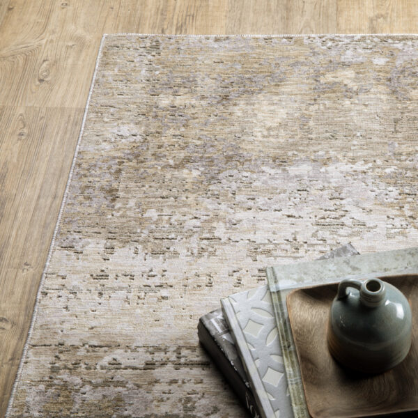 8' X 11' Beige Grey Ivory Tan And Brown Abstract Power Loom Stain Resistant Area Rug