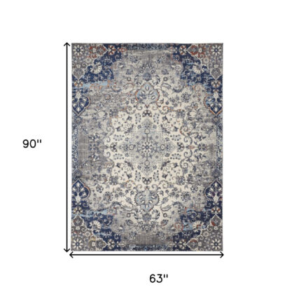 5' X 8' Ivory Gray And Blue Floral Power Loom Distressed Stain Resistant Area Rug
