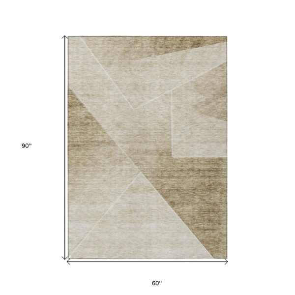 5' X 8' Beige Tan And Ivory Abstract Washable Indoor Outdoor Area Rug