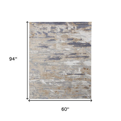 5' X 8' Tan Orange And Ivory Abstract Power Loom Distressed Area Rug