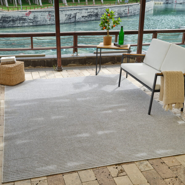 5' X 7' Cream and Beige Striped Distressed Indoor Outdoor Area Rug