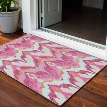 3' X 5' Pink Mauve And Orange Ikat Washable Indoor Outdoor Area Rug
