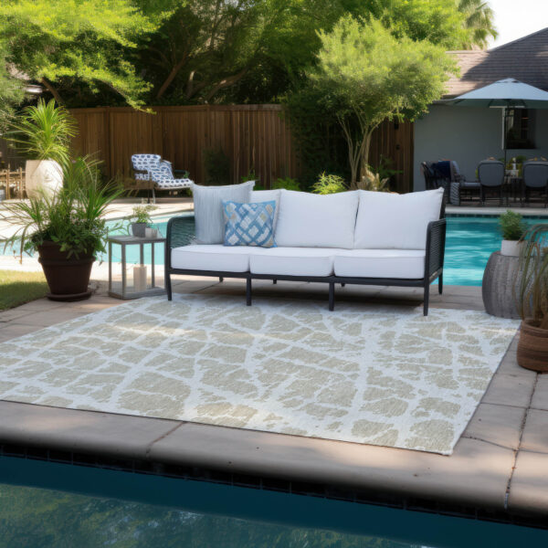 5' X 8' Beige and Ivory Abstract Washable Non Skid Indoor Outdoor Area Rug