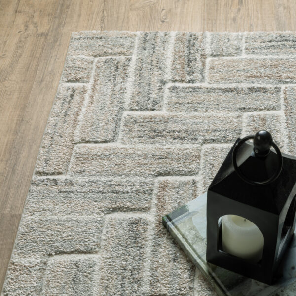 6' X 9' Ivory Beige Grey Brown Pale Blue And Charcoal Geometric Power Loom Stain Resistant Area Rug