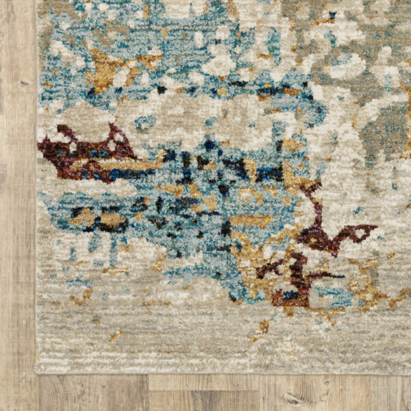6' X 9' Beige And Blue Abstract Power Loom Stain Resistant Area Rug
