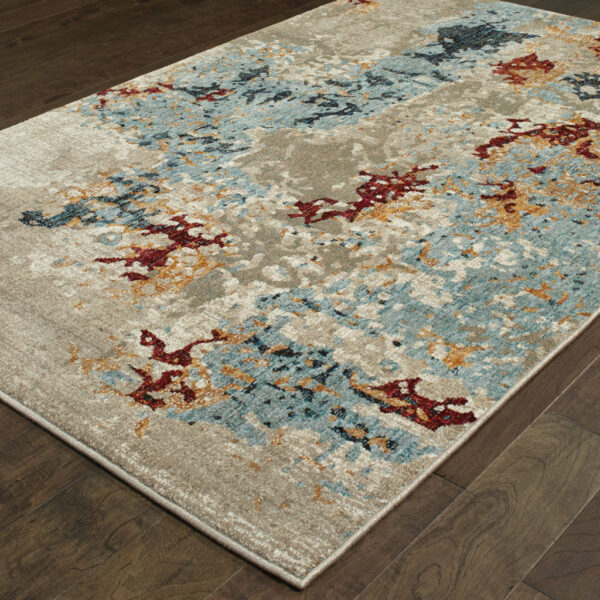 6' X 9' Beige And Blue Abstract Power Loom Stain Resistant Area Rug