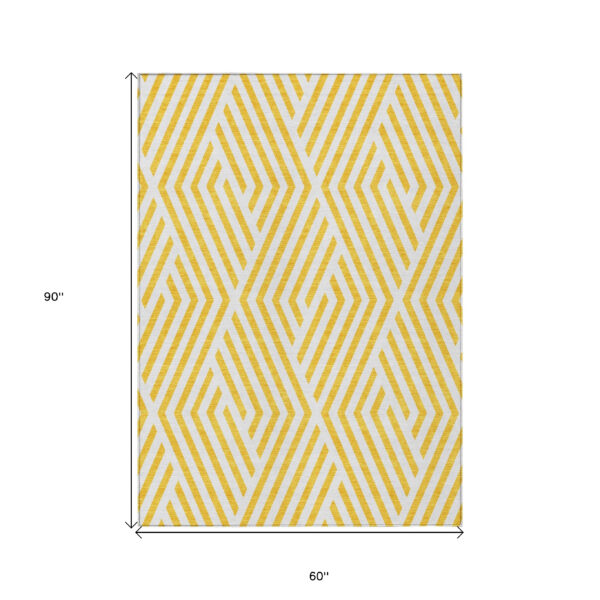 5' X 8' Gold and White Geometric Washable Non Skid Indoor Outdoor Area Rug