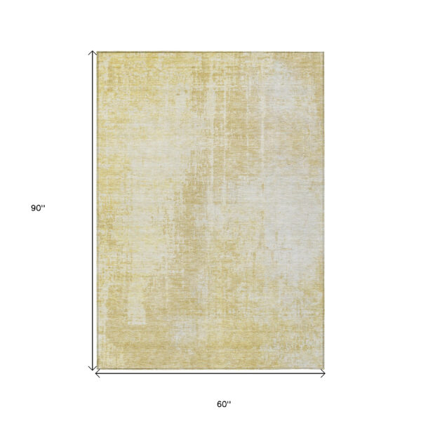 5' X 8' Gold Ivory And Beige Abstract Washable Indoor Outdoor Area Rug