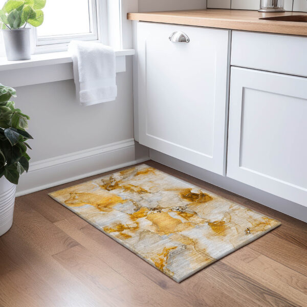 2' X 3' Orange and Ivory Abstract Washable Non Skid Indoor Outdoor Area Rug