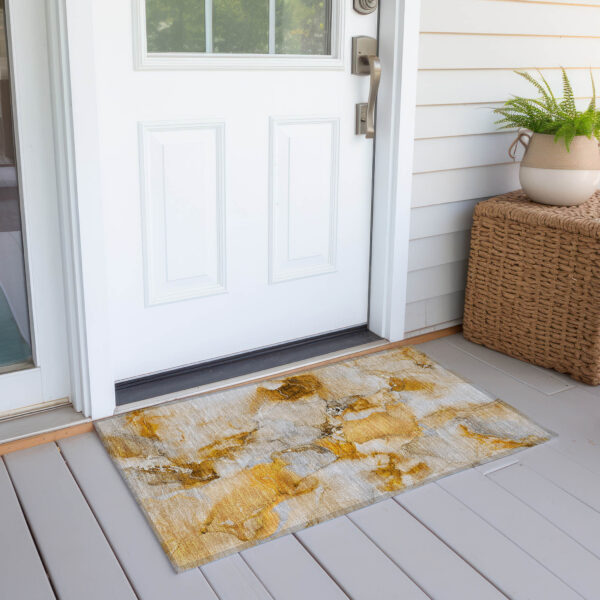 2' X 3' Orange and Ivory Abstract Washable Non Skid Indoor Outdoor Area Rug