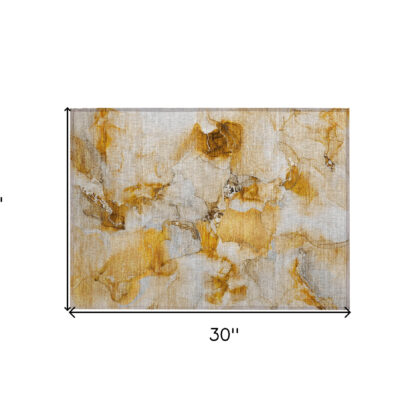 2' X 3' Orange and Ivory Abstract Washable Non Skid Indoor Outdoor Area Rug