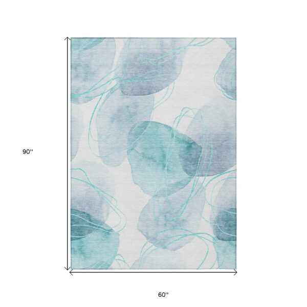 5' X 8' Teal and Ivory Abstract Washable Non Skid Indoor Outdoor Area Rug