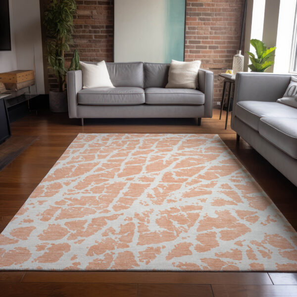 5' X 8' Peach and Ivory Abstract Washable Non Skid Indoor Outdoor Area Rug