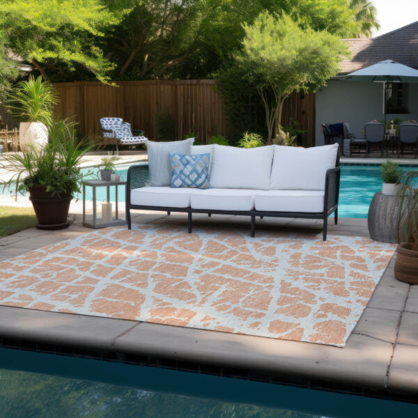 5' X 8' Peach and Ivory Abstract Washable Non Skid Indoor Outdoor Area Rug