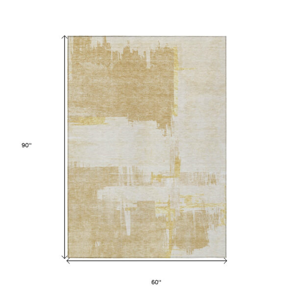 5' X 8' Beige Gold And Tan Abstract Washable Indoor Outdoor Area Rug