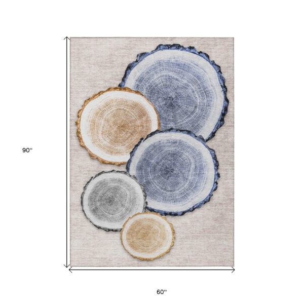 5' X 8' Beige Blue and Gold Faux Bois Washable Non Skid Indoor Outdoor Area Rug